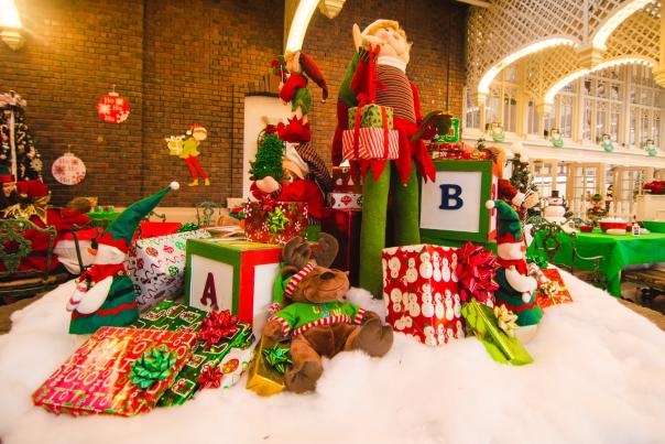 Christmas decorations with gifts and an elf on a table at the Chattanooga Choo Choo