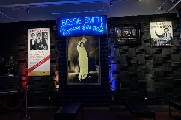 photo of museum exhibit shows large Bessie Smith image among other artists
