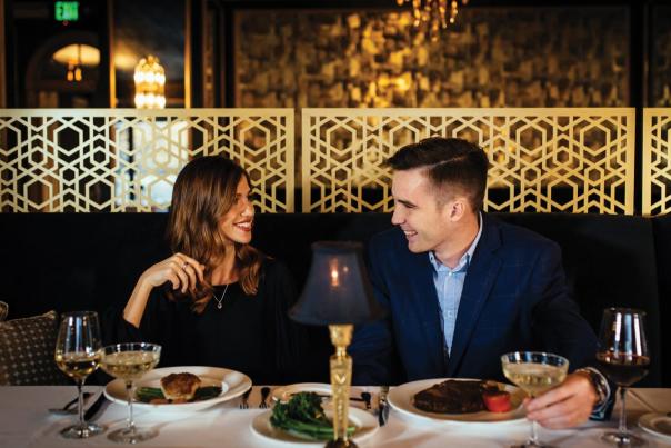 Couple eats meal at Bridgeman's Chophouse