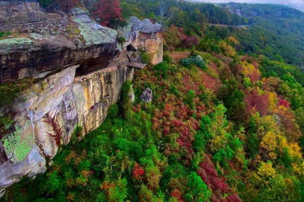 bright reds stand out in fall foliage on side of Lookout Mountain taken from Rock city