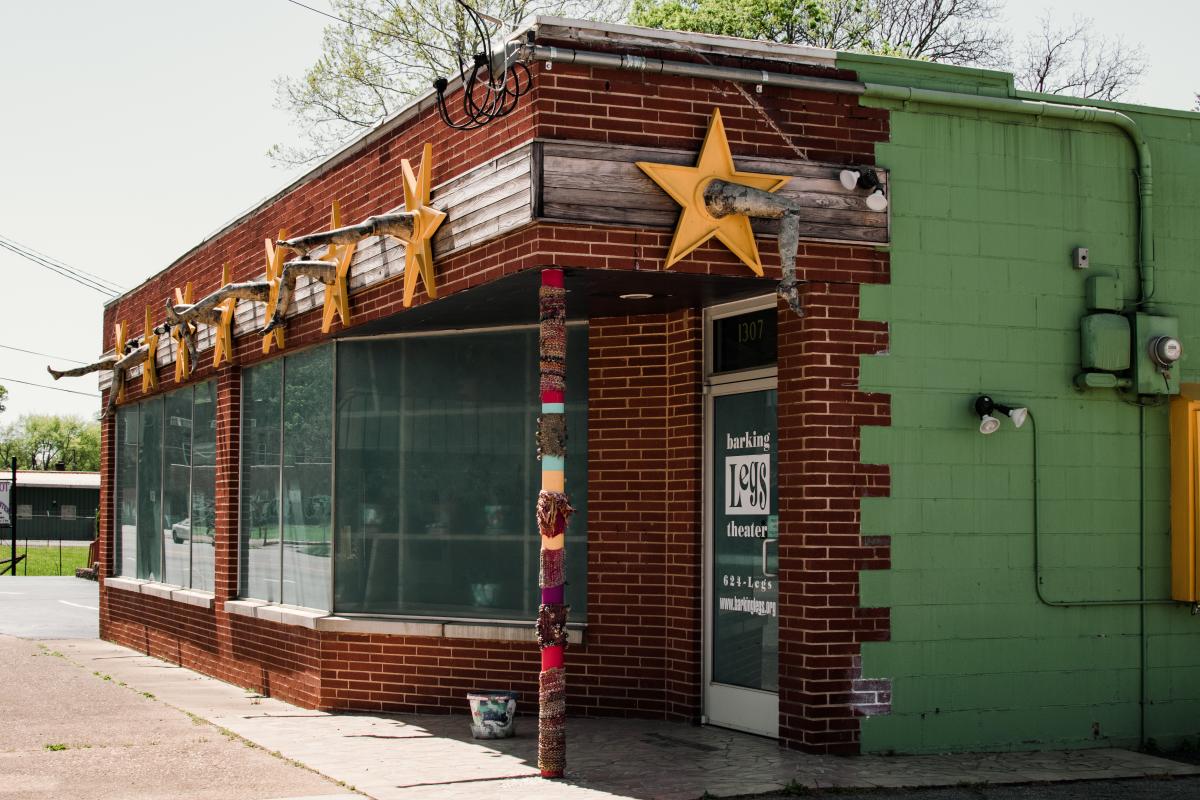 Outside of building. Yellow stars on brick building.