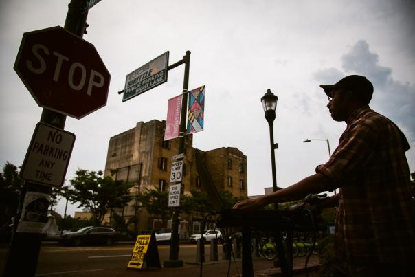 Artist performs on state street with sidewalk stages