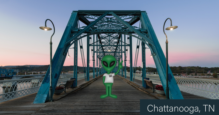 Extra Terrestrial visitor stands on walking bridge