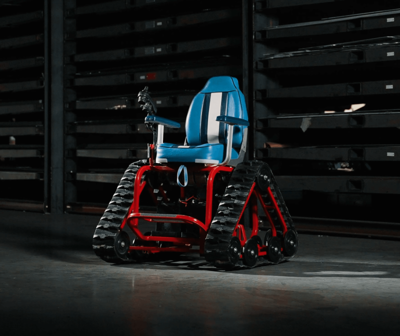 Image of wheelchair (action track chair) with triangular wheels made for outdoor adventure